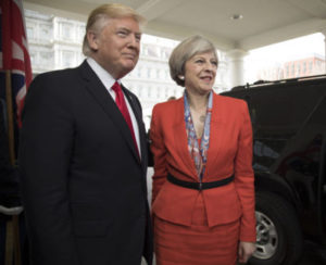 President Donald Trump greets British Prime Minister Theresa May upon her arrival, Friday, Jan. 27, 2017, to the West Wing entrance of the White House in Washington, D.C.